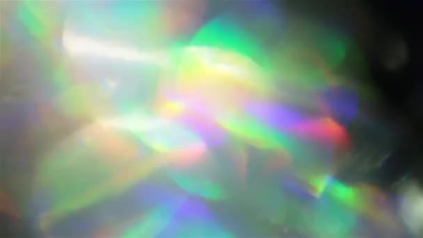 Színes rgb bokeh, spektrális futurisztikus színek, holografikus irizáló fólia. — Stock videók