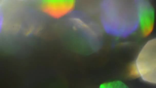 홀로그램 형형색색된 무지개 빛깔의 포 일 빛 누출. — 비디오