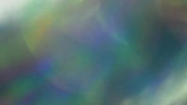 Holografik yanardöner folyo hareket. Çok renkli yüzey ve parlak arka plan.