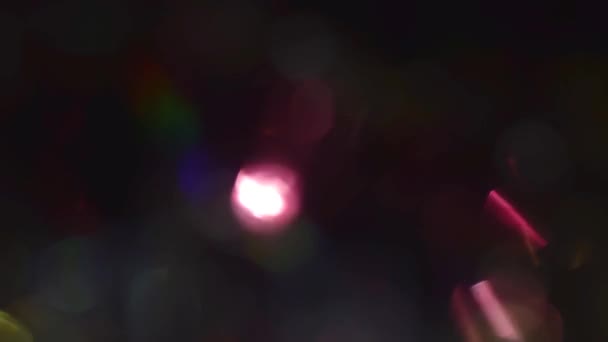 Verschiedene farbige Lichter bokeh. Kreativer Hintergrund. — Stockvideo