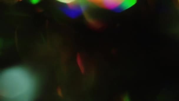Natural shiny holographic light leaks on iridescent foil. — Stock Video