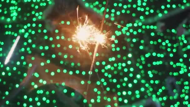 Bengal fires, sparklers and colorful bokeh christmas, new year background. — Stock Video