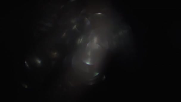 Combination of defocused particles in warm and cold hue, randomly changing shape. — Stock Video