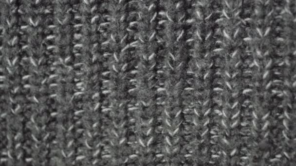 Knitted fabric winter gray sweater. Detailed close-up in UHD resolution. — Stock Video