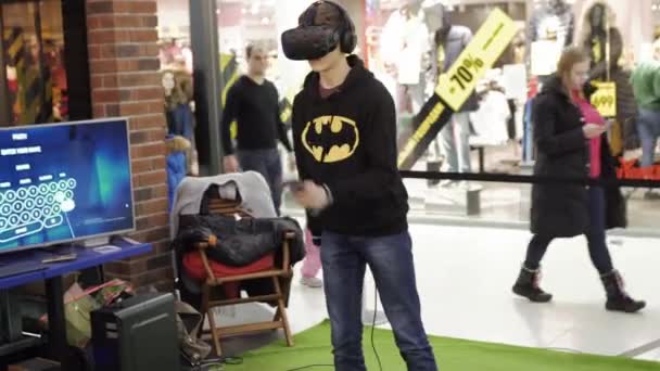 SUMY, UKRAINE - JAN 26, 2019: Teen boy having immersive gaming experience. — Stock Video