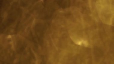 Sıcak sarı arka plan, bulanık folyo. Aksaklık etkisi, renk sapmalarını, goniochromism.