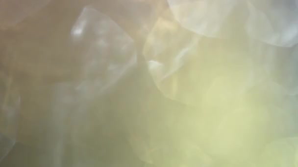 Mooie abstracte iriserende achtergrond met glanzende, schitterende bokeh. — Stockvideo