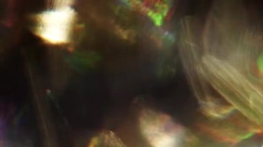 Yanardöner holografik folyo. Parlak renkli bokeh. Işık.