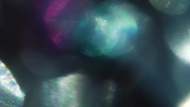 Fondo abstracto creativo, lámina iridiscente, bokeh vibrante . — Vídeo de stock