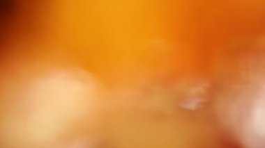 Fütüristik soyut turuncu renkte yanıp söner, parlak bokeh, sorunsuz döngü, yardımcı grafik efekti, yaratıcı geçiş, sorunsuz arka plan.