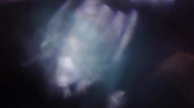 Yanardöner doğal arka plan, benzersiz renkli bokeh. Işık sızıntıları, deformeler, video geçişler.