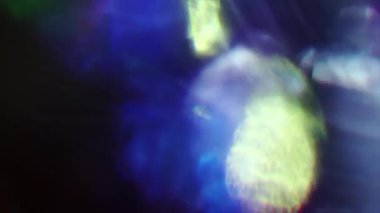 Şenlikli soyut arka plan, canlı gökkuşağı bokeh. Glares, ışık sızıntıları, deformeler, video geçişler.