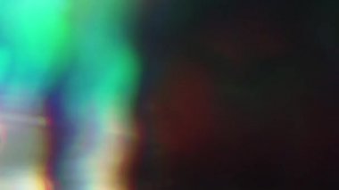 Shining çok renkli ışık unsurları karanlıkta rasgele hareket. Farklı geçişler, güzel bokeh.
