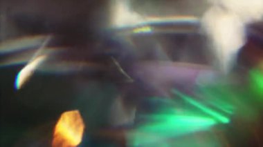 Canlı bulanık ışık parçacıkları siyah arka planda parlar. Şenlikli geçişler, video bindirme. 