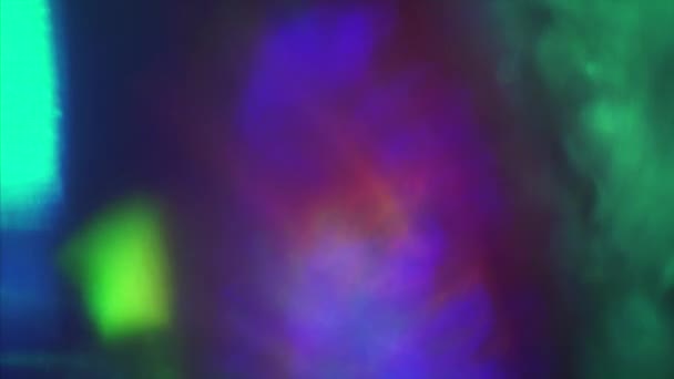 Brillantes elementos de luz multicolor que brillan sobre el fondo negro . — Vídeos de Stock