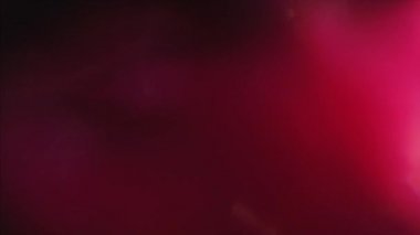 Lüks lensler sıcak kırmızı tonlarda parlar. Sürrealist ışık başkalaşımları. Karanlıkta parlayan ışıklar. Hareket tasarımı için kullanılabilir.