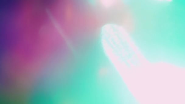 Festive holographic background. Beautiful light transitions. Peace of light pulsing in the dark. — Stock Video