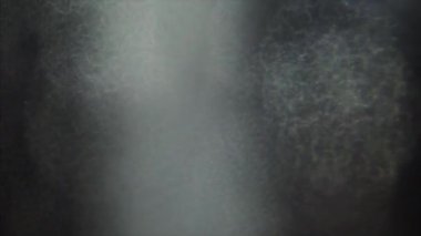 Döngülü bokeh arkaplan. Güzel ışık geçişleri. Işık vuruşları koyu arkaplanda. 