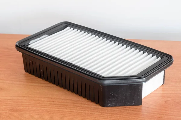 Car air filter. Spare part for car engine air filter for cleaning dust and dirt.