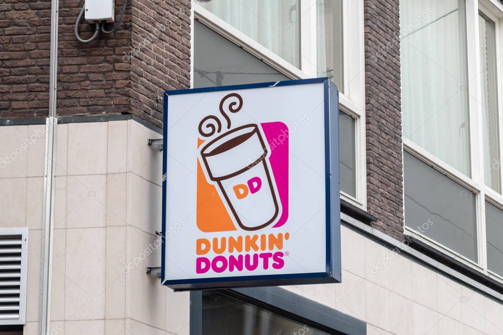 Amsterdam, Netherlands - June 7, 2019: Dunkin's Donut logo and sign.