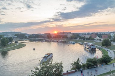 Panoramic view of Vistula River at sunset time in Krakow. clipart