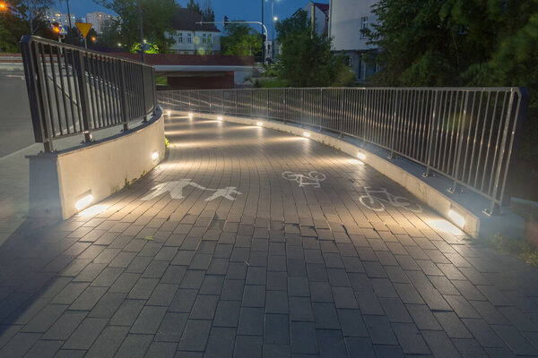 Foot and cycling path at night in the city.