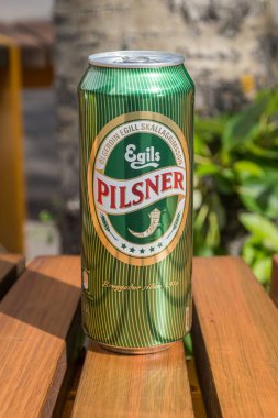 Reykjavik, Iceland - June 19, 2020: Egils Pilsner beer by Icelandic brewery and beverage company Olgerdin Egill Skallagrimsson. clipart