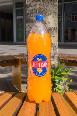 Reykjavik, Iceland - June 19, 2020: Bottle of Egils Appelsin. Appelsin is a fizzy orange-flavored soft drink, manufactured by Egill Skallagrimsson Brewery in Iceland. clipart