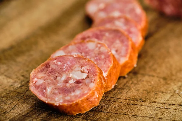 Sliced sausage on cutting board — Stock Photo, Image