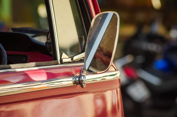 Vintage wing mirror of a car.