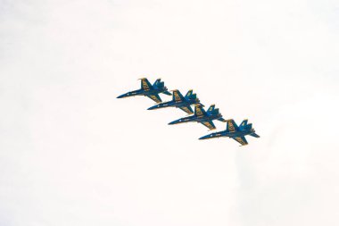 Chicago, IL - August 20th, 2017: The United States Navy Blue Angels demonstration squadron jets fly over the city entertaining crowds near North Avenue Beach during the annual Air and Water show clipart