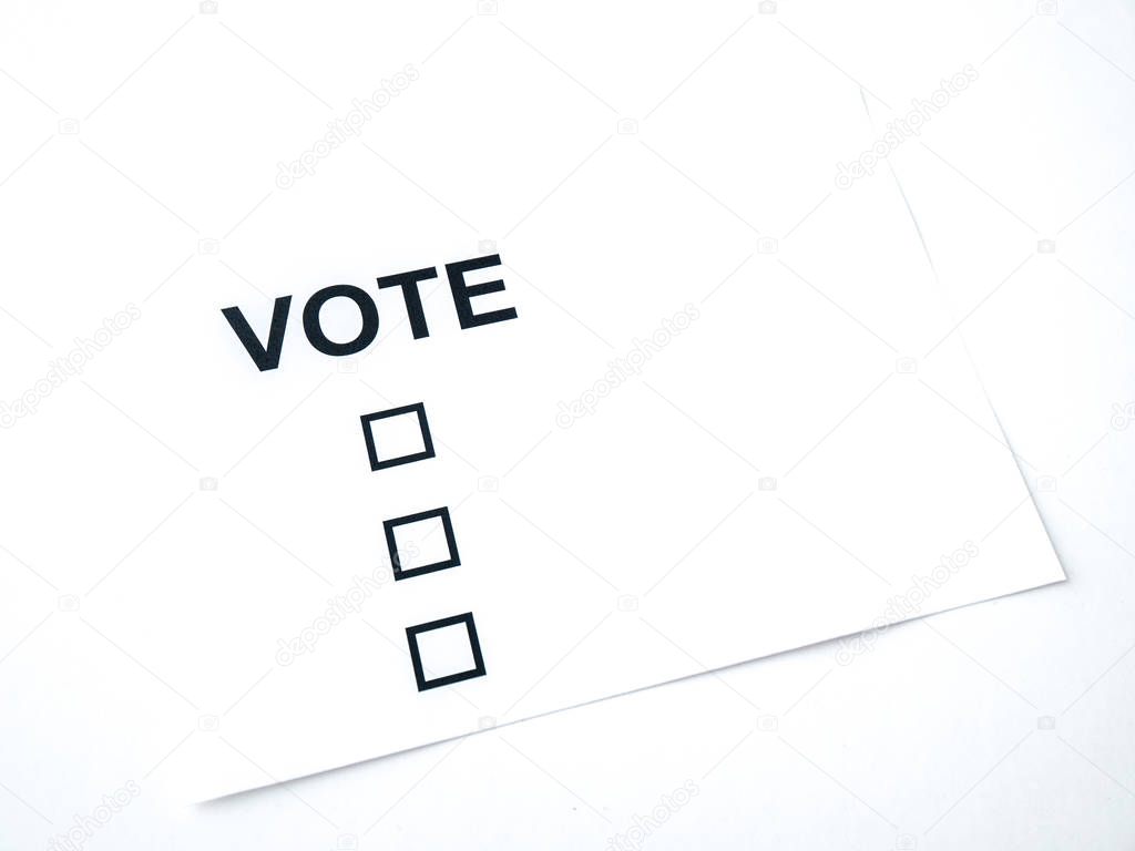 A closeup photograph of a blank generic vote ballot on white paper and white background.