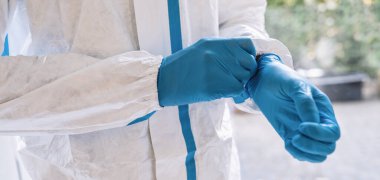 caregiver wearing a medical Latex gloves at work to prevent corona COVID-19 and SARS infection during coronavirus pandemic
