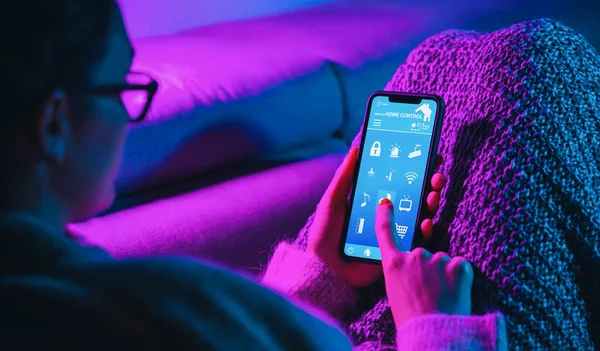 Woman Lies Sofa Unlock Door His House Smart Home Technology — Stok fotoğraf