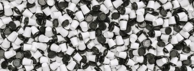 Heap of many empty white to go coffee cups as a background, banner size