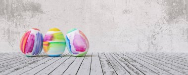Painted easter eggs for Easter in front of grunge background wall, including copy space, banner size