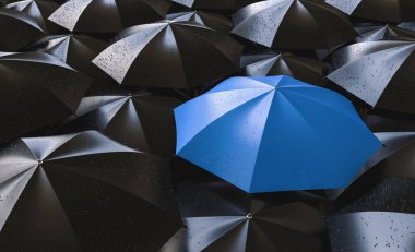 Red umbrella between black ones, standing out of the crowd concept image