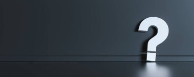 Big white question mark in front of black wall with copy space as faq concept