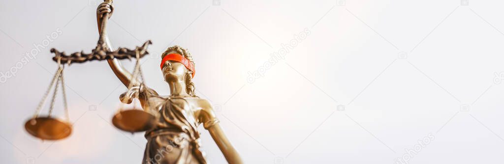 The Statue of Justice - lady justice or Iustitia / Justitia the Roman goddess of Justice with red blindfold, banner size, copyspace for your individual text.
