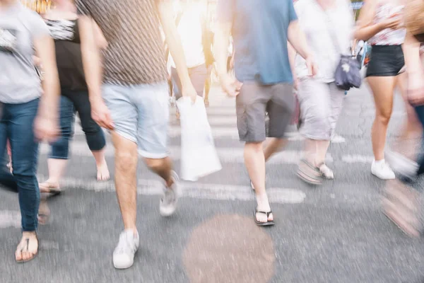 anonymous crowd of people on a shopping street