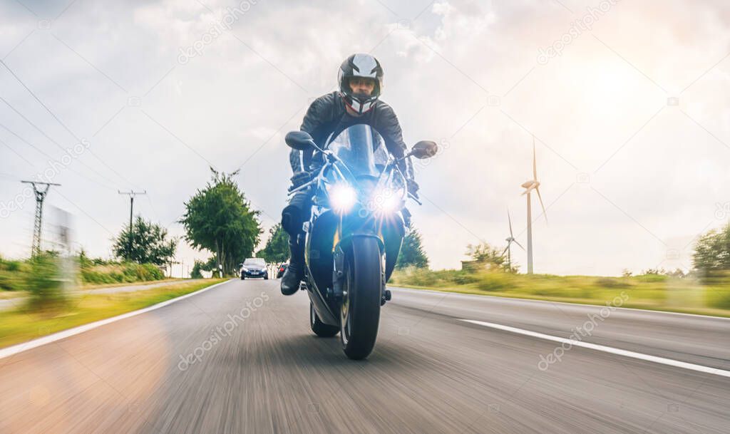 motorbike on the road riding fast. having fun driving the empty road on a motorcycle tour journey. 