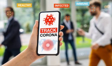 coronavirus tracker app on a mobile smartphone. Close up of woman tracking crowd of people in a smartphone screen application. Hand holding smart device. Mockup website. covid-19 corona virus tracker