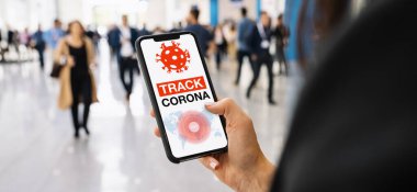 coronavirus tracker app on a mobile smartphone. Close up of woman tracking crowd of people in a smartphone screen application. Hand holding smart device. Mockup website. covid-19 corona virus tracker