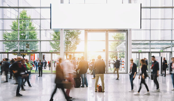 Crowd of business people walking, with banner and copy space for individual text