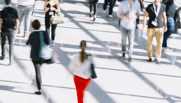 Crowd of people walking on a street in New York City