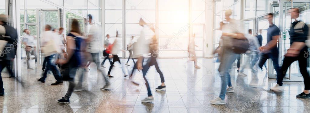 Many anonymous people as a visitor to a business trade fair