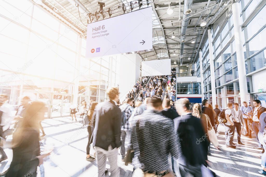 blurred business people at a trade fair