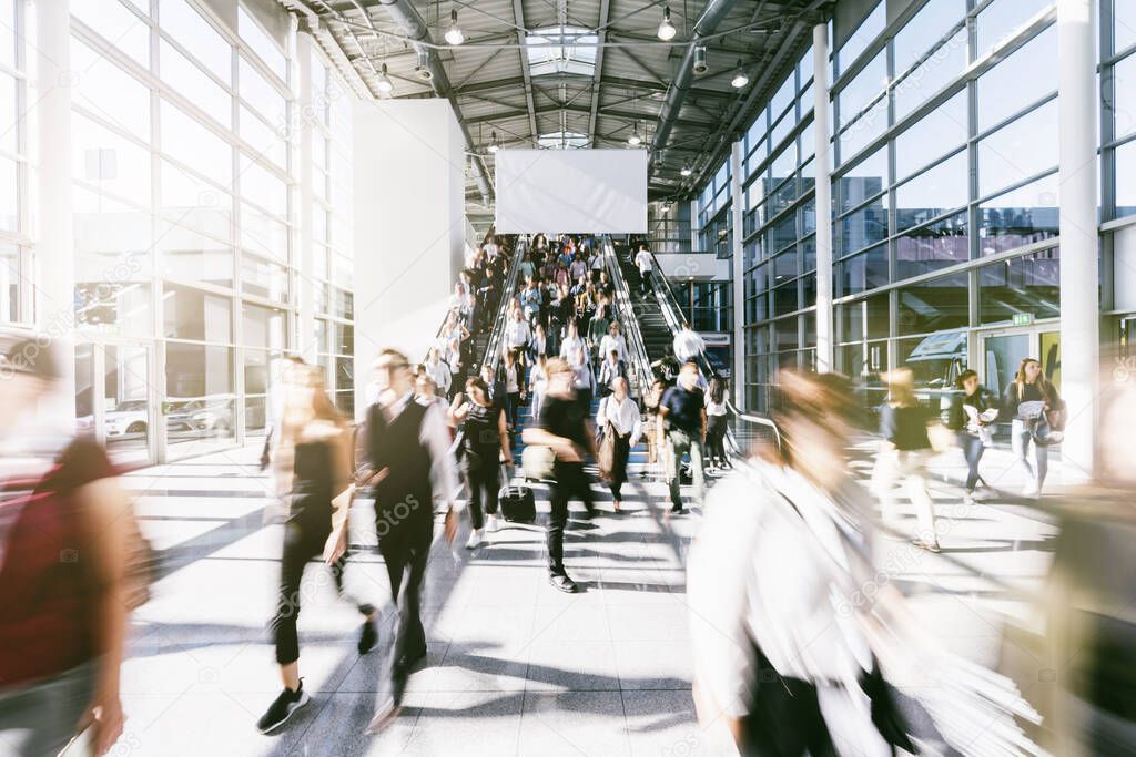 blurred business people at a trade fair