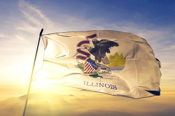 Illinois state of United States flag textile cloth fabric waving on the top sunrise mist fog