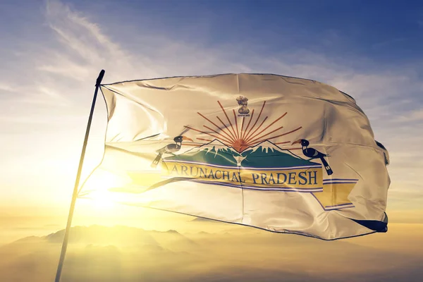 Arunachal Pradesh state of India flag textile cloth fabric waving on the top sunrise mist fog